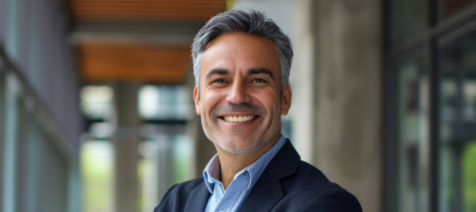 CFO wearing a suit smiling