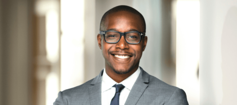 Man professionally dressed with grey suit