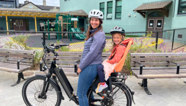 Ontra employee Leah Chapman riding bicycle