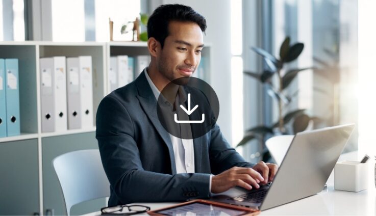 A photo of a man typing in a laptop computer with a play button icon overlaid.