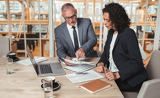 Man and woman reviewing a document