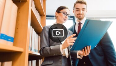 Man and woman looking at a document