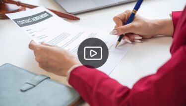 Woman signing a contract