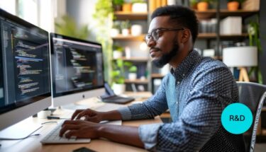 Man coding on a computer