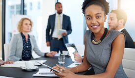 A photo of professionally dressed office employees