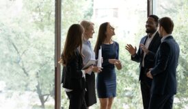 Group of professionals speaking with each other