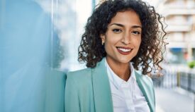 Professionally dressed woman smiling