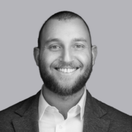 Professional headshot for Josh Nulman in black and white