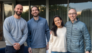 Four sales team members from Ontra standing next to each other