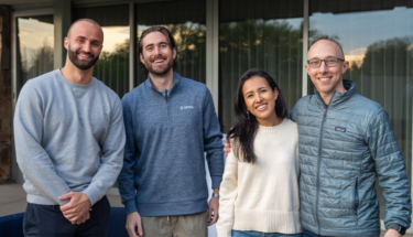 Four sales team members from Ontra standing next to each other